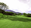 The par-5 fourth hole at The Dunes at Maui Lani features an undulating fairway and an array of pot bunkers.