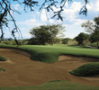 The Dunes at Maui Lani Golf Course's par-4 12th hole features a large bunker beside the green. 