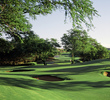 The Dunes at Maui Lani Golf Course's par-3 eighth hole is guarded by pot bunkers.  