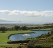 Kahili Golf Course's par-3 eighth hole features a pond in front of the green and views out to the ocean. 