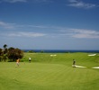 Makai Golf Club's par-4 15th hole plays to a green overlooking the ocean.