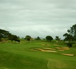 The par-5 eighth hole at Puakea Golf Club features a collection of bunkers on the right side and in front of the green.