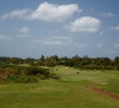 The par-4 16th hole wraps around the coastline at Poipu Bay Golf Course on Kauai's south shore. 