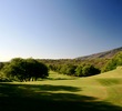 The ninth hole at the Dunes at Maui Lani Golf Course is a par 5 that plays uphill to an elevated green. 