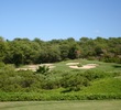 The 11th hole on the Gold Course at Wailea Golf Club is a par 3 over brush. 