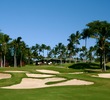 The par-4 ninth hole on the Gold Course at Wailea Golf Club plays uphill toward the clubhouse. 