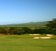 The par-4 second hole at Kahili GC is a downhill, dogleg right to a well guarded green.