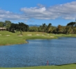 A large pond comes into play on several holes on the back nine at Ewa Beach Golf Club, like the par-5 10th hole seen here. 