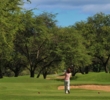A woman hits toward the sixth green at Ewa Beach Golf Club.
