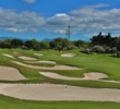 White bunkers stack up the left side of the fourth green at Ewa Beach Golf Club.