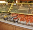The seafood buffet at the Prince Court restaurant of the Hawaii Prince Hotel Waikiki attracts a crowd at dinner. 