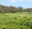 Flying over the jungle is no easy task to reach the 17th green at Poipu Bay Golf Course on Kauai. 
