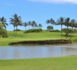A pond sits next to the 13th green at Poipu Bay Golf Course on Kauai. 