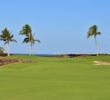 The sixth hole of the South golf course at Mauna Lani Resort bends left among the lava rock. 