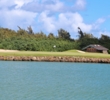 Water intrudes on the approach to the par-3 fourth hole on the Palmer Course at Turtle Bay Resort in Hawaii. 