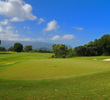 The fifth hole at Makai Golf Club is a dogleg left, parkland par 5.