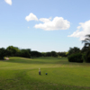 View of a fairway and green at Coral Creek Golf Course