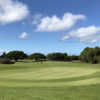 A sunny day view of a green at Kiahuna Golf Club.