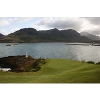 Kauai Lagoons Golf Club's 16th green is drivable off the tee but most balls kick left into the ocean. 