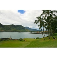 The par-4 seventh hole on Kauai Lagoons Golf Club's Kiele Moana nine is a short par 4 with a peninsula green beside the ocean. 